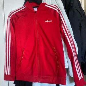 Red adidas woman’s track jacket size medium.